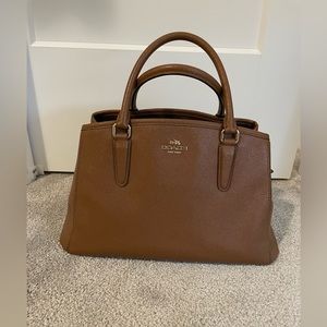 Brown sturdy leather Coach purse